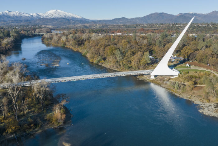 Sundial Bridge with snowy mountains in the background
